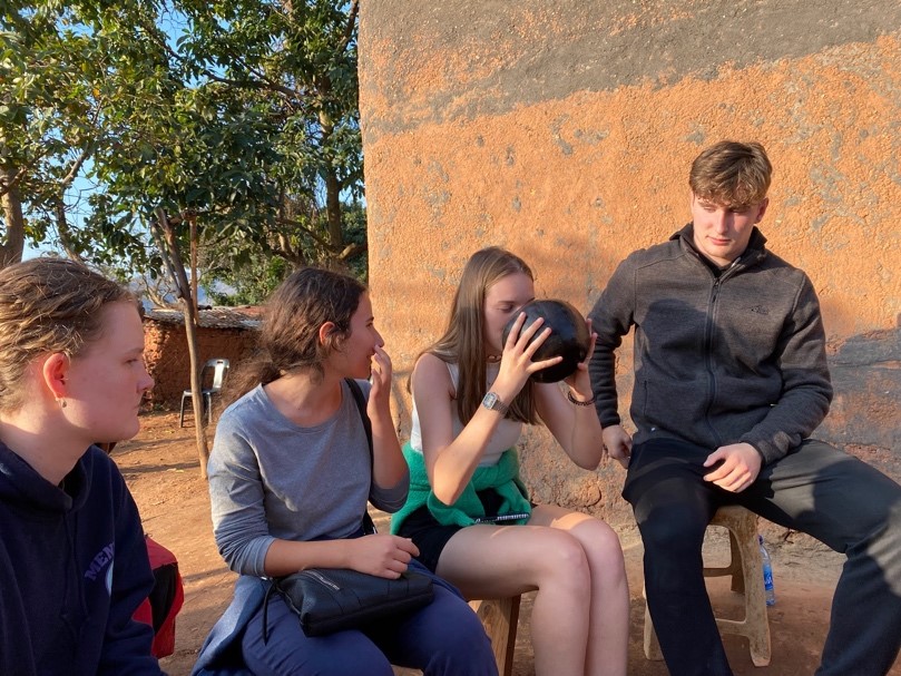 Anna, Simona, Alex and myself sharing traditional beer during our Lobamba Tour 