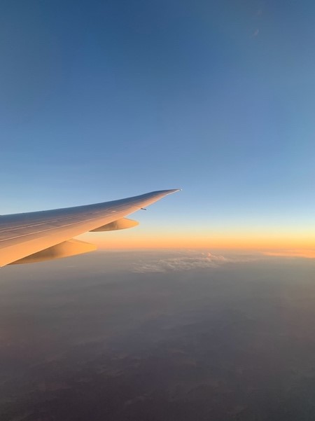 View from the window of the airplane at the sunrise. Landing in OR Tambo, South Africa 