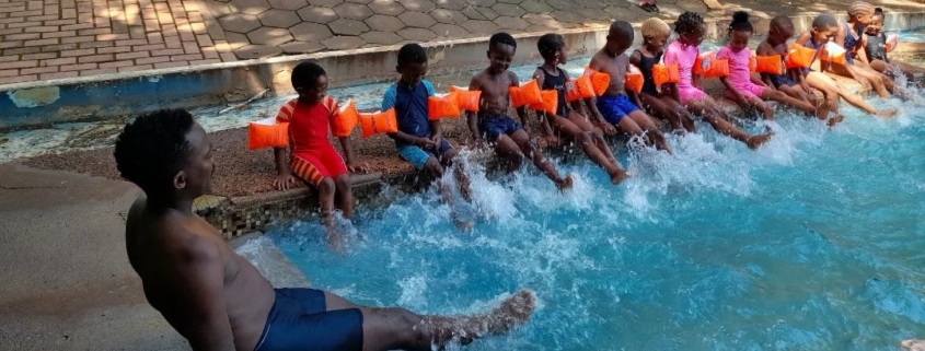 Bandile having swimming lessons with the ncp children